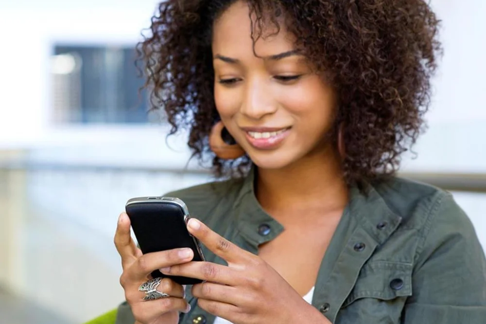 stellcomdigital a cheerful user engaging with mobile friendly website stellcomdigital a cheerful user engaging with mobile friendly website